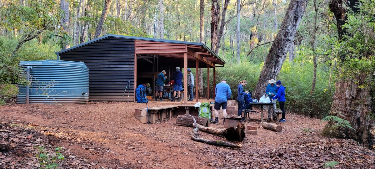 Walkers crossing a creek on the Bibbulmun Track